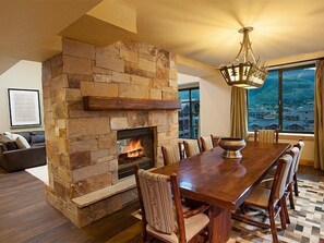 Warm up by the fireplace or entertain at the dining table.