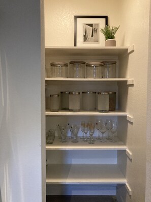 walk-in pantry with canisters for food storage