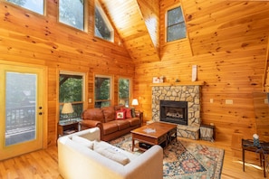 Warm Wood Interior with A-Frame Windows and Gas Fireplace