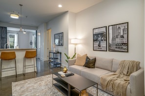 Bright and open concept living space draped in designer furnishings.