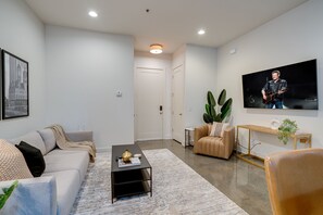 Bright and open concept living space draped in designer furnishings.