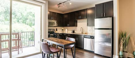 Enjoy your dinner prepared in this spacious kitchen at the table for two. 