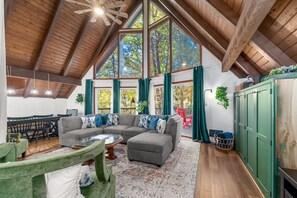 Open living and dining area - soaring ceiling and huge windows/patio doors