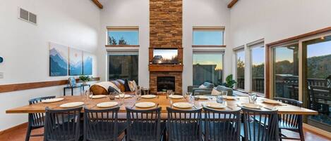 Imagine having dinner here with everyone! You can fit up to 14 people, plus the 4 barstools at the kitchen island, and the patio table holds 6 more people.