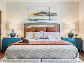 Relax in the luxurious master bedroom, featuring stylish decor, plush bedding, and a calming atmosphere to ensure a peaceful night’s sleep.