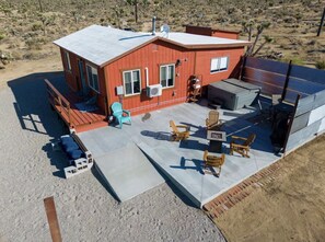 Hot tub, grill, fire pit, seating areas 