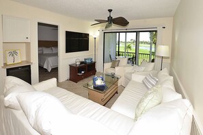 Living Room With Direct Access to Balcony Overlooking Lakes & Golf Course
