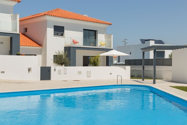 The large swimming pool in front of the villa which is part of a secure complex.