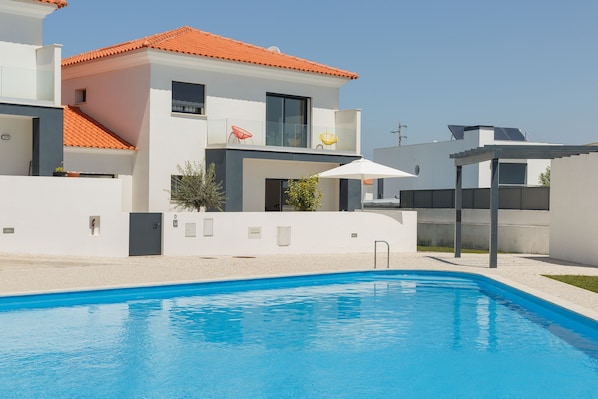 The large swimming pool in front of the villa which is part of a secure complex.