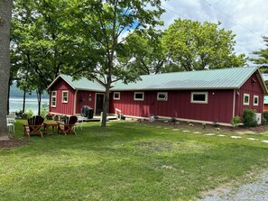 Front of house with view of Lake Champlain in the background.