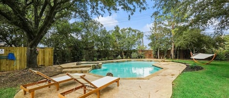 This tropical pool oasis is yours to enjoy! Feel free to alternate between the swinging hammock, poolside loungers, and of course, the pool itself!