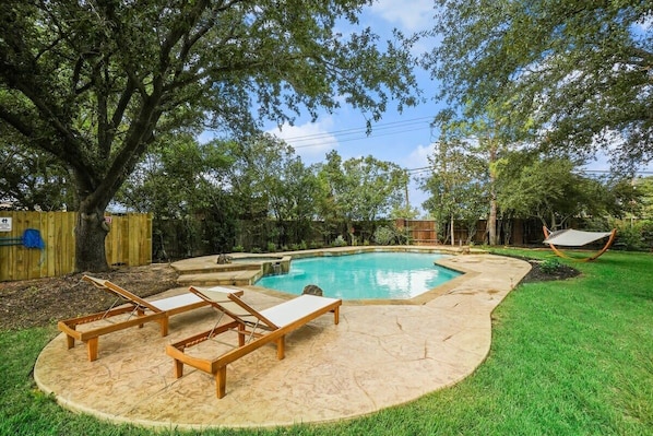 This tropical pool oasis is yours to enjoy! Feel free to alternate between the swinging hammock, poolside loungers, and of course, the pool itself!