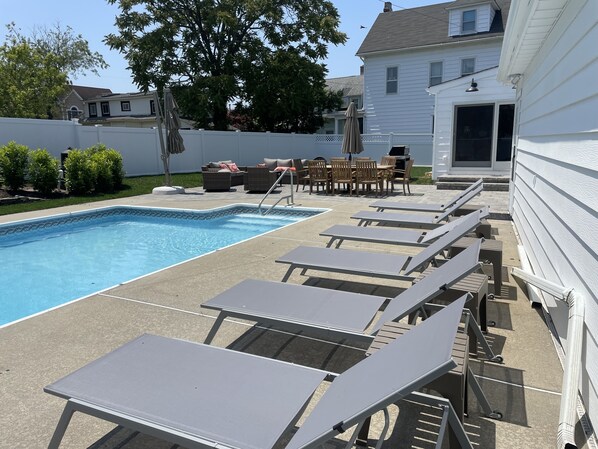 Pool area - updated with new patio and sliding door from kitchen 