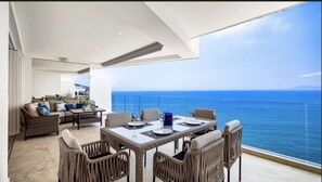 Eat al fresco on the large terrace or relax in the spacious lounge area.
