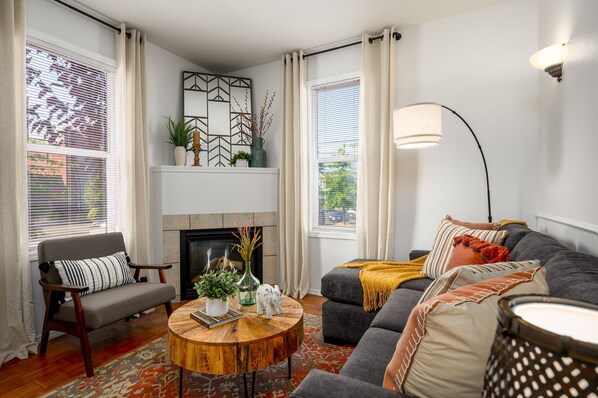 Light-filled, modern living room with gas fireplace and plenty of natural light!