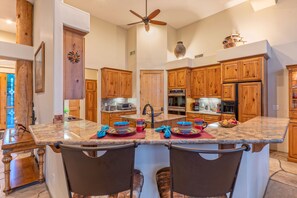 Cheers to the modern and open kitchen with counter seating.