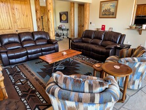 Open living spaces are awash with natural light and embrace a southwestern theme.