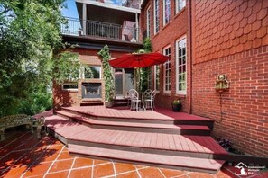 Rear entry is up the stairs on the side near the canal in the backyard
