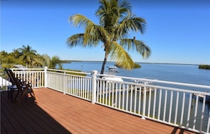 3rd floor Master Bedroom deck view of Bay and Osprey in Palm Tree