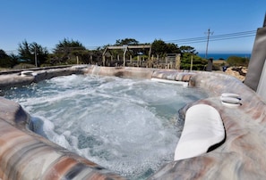 The private, secluded ocean-view hot tub is reserved only for you. The hot tub uses salt as a sanitizer and is serviced after each guest's stay.