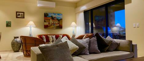 Spacious Living room has authentic Mexican furniture, double glass sliders-patio