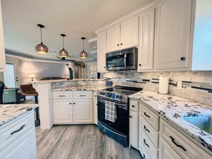 Wine and dine in your own private kitchen stocked with all kitchen essentials.