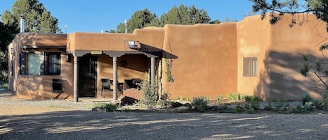 The Q house is a classic adobe home with nearby casita, (little house).