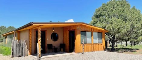 The Ranch House has 3 BRs, a casita, horse boarding, trails, & a wood hot tub.