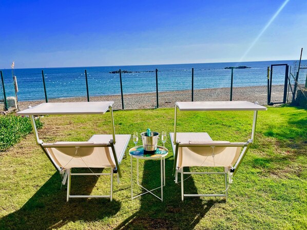 Relax and unwind overlooking the beach and ocean