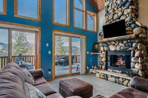 Watch a movie by the fire.

The cabin has several smart TVs, all of which allow guests to login to their own streaming accounts.
