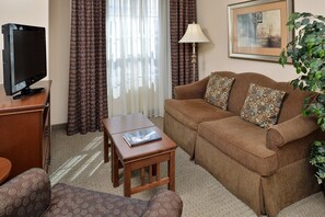 Sink into the cozy sofa after a day exploring the area.