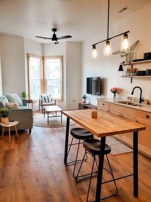Open concept kitchen/living room with Main Street views (1)