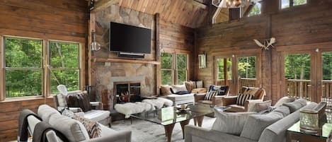 Living room with fireplace and smart tv.
