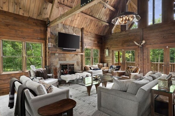 Living room with fireplace and smart tv.