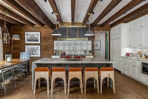 Stylish kitchen with oversized island and dining area.