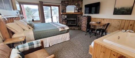 King-size bed, wood-burning fireplace, jacuzzi tub, and amazing views!