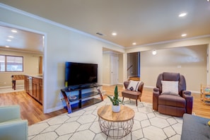 Living room with smart TV. Note that this room has a futon sofa that can accommodate one guest,