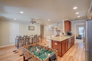 Kid-sized pool table and dining area for hang out