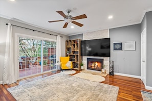 Living room with 82-inch TV.