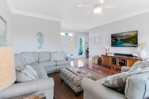 Living area with plenty of comfy seating. Watch TV or choose from a variety of games.