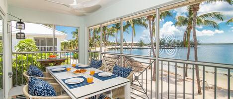 Beachfront dining on the screened balcony.