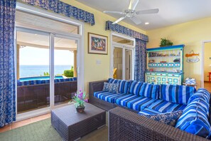 Comfy sectional sofa in the living area with gorgeous ocean views.