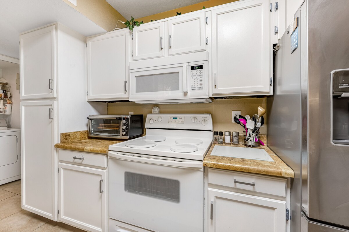Dog-friendly condo with enclosed patio, pool, hot tub, & W/D – snowbirds OK
