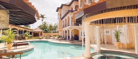 Private Pool with Swim-Up Bar and Hot Tub. Television in Both Section.