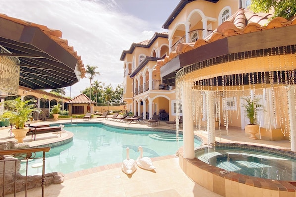 Private Pool with Swim-Up Bar and Hot Tub. Television in Both Section.