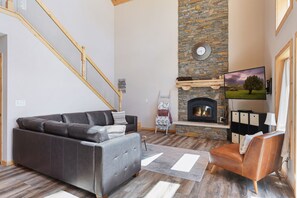Living room w/ wood burning fireplace