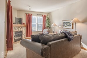 Living Room with a Flat Screen TV and Cozy Gas Fireplace 