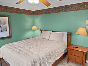 Queen-sized bed in bedroom; with Flat screen TV