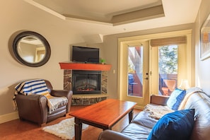 Curl up to a movie with the family in this spacious living room