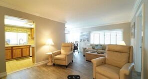 Large Family room with new Porcelain tile floors and new electric recliners 